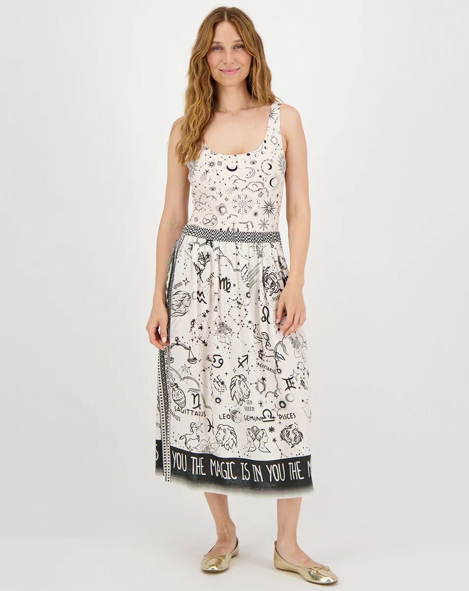 beige midi skirt with black border and zodiac print on model front view