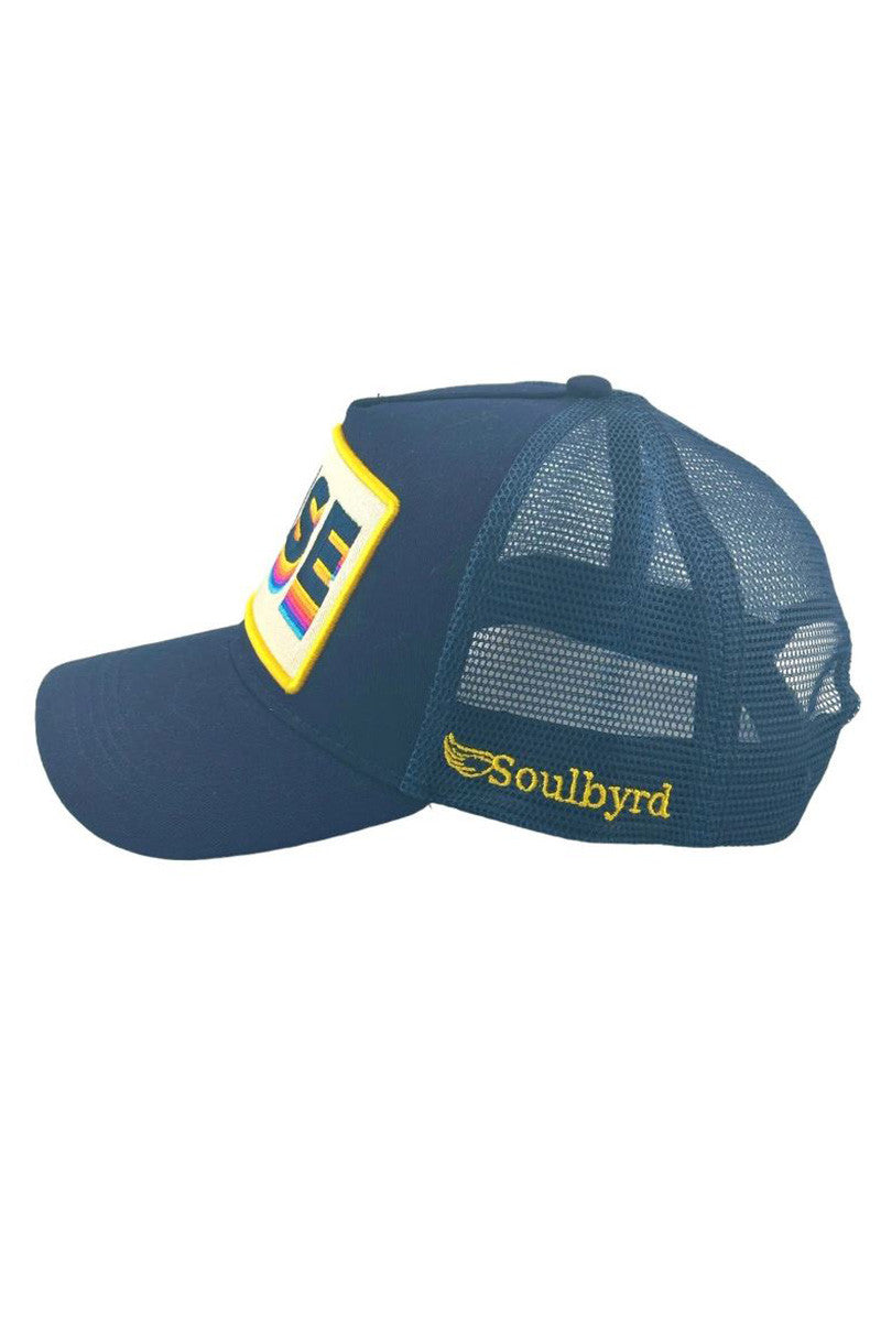 Rise trucker hat in navy side view