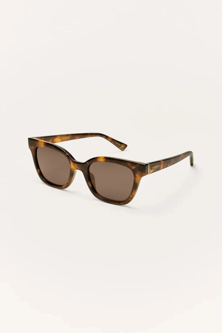 Polarized sunglasses with tortoise frame and brown tinted lenses, side profile