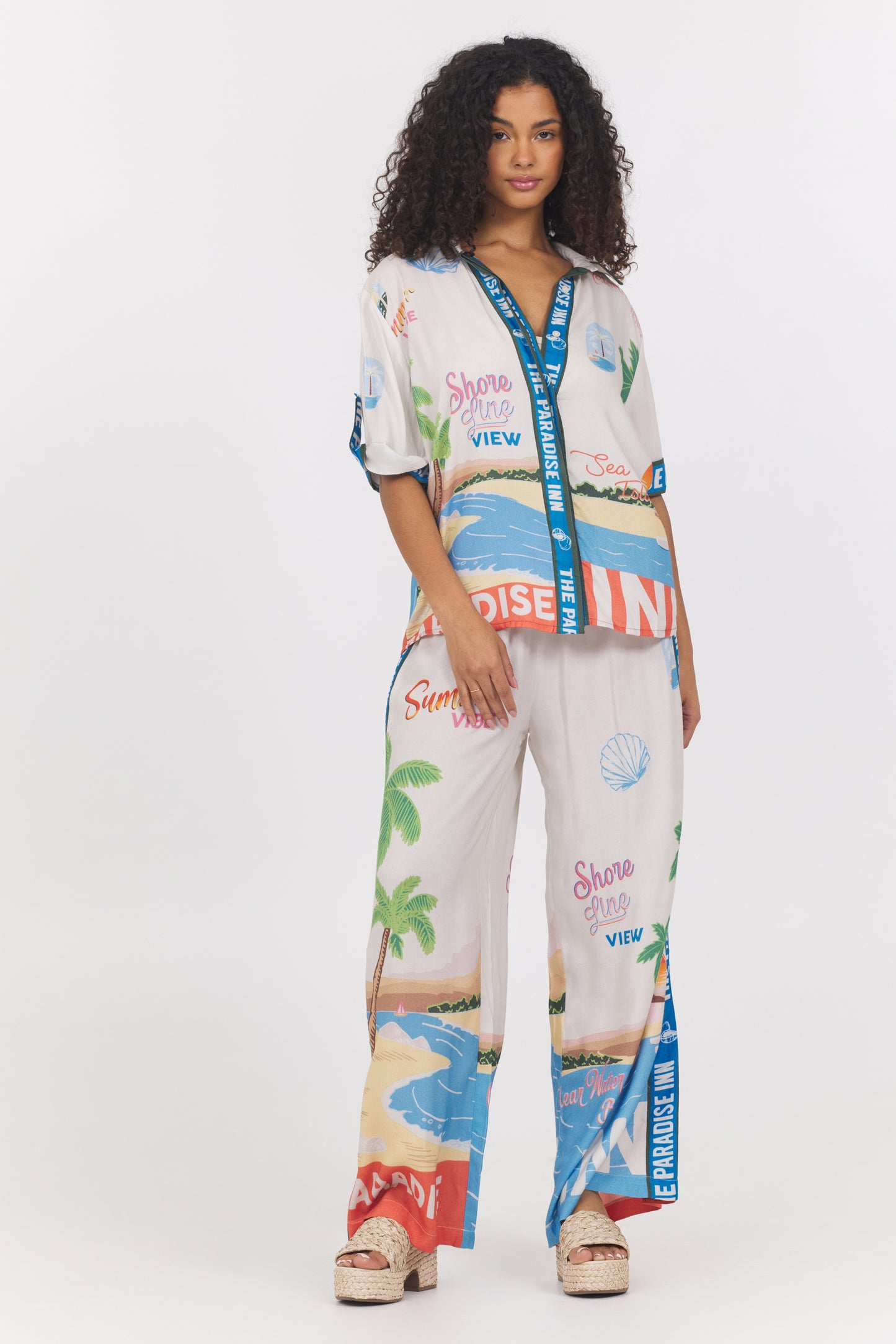 Printed short sleeve button down top in paradise inn front view