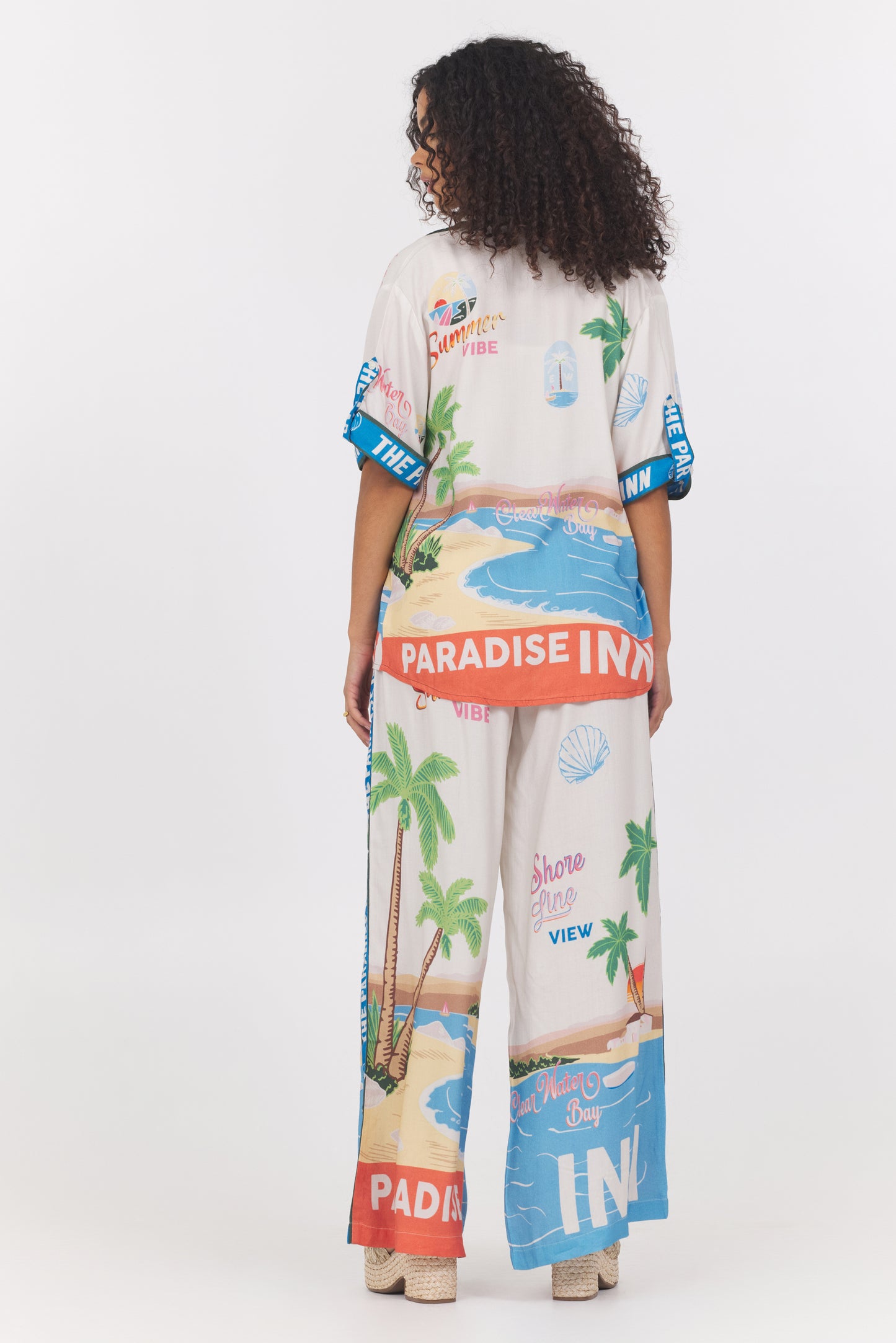 Printed short sleeve button down top in paradise inn back view