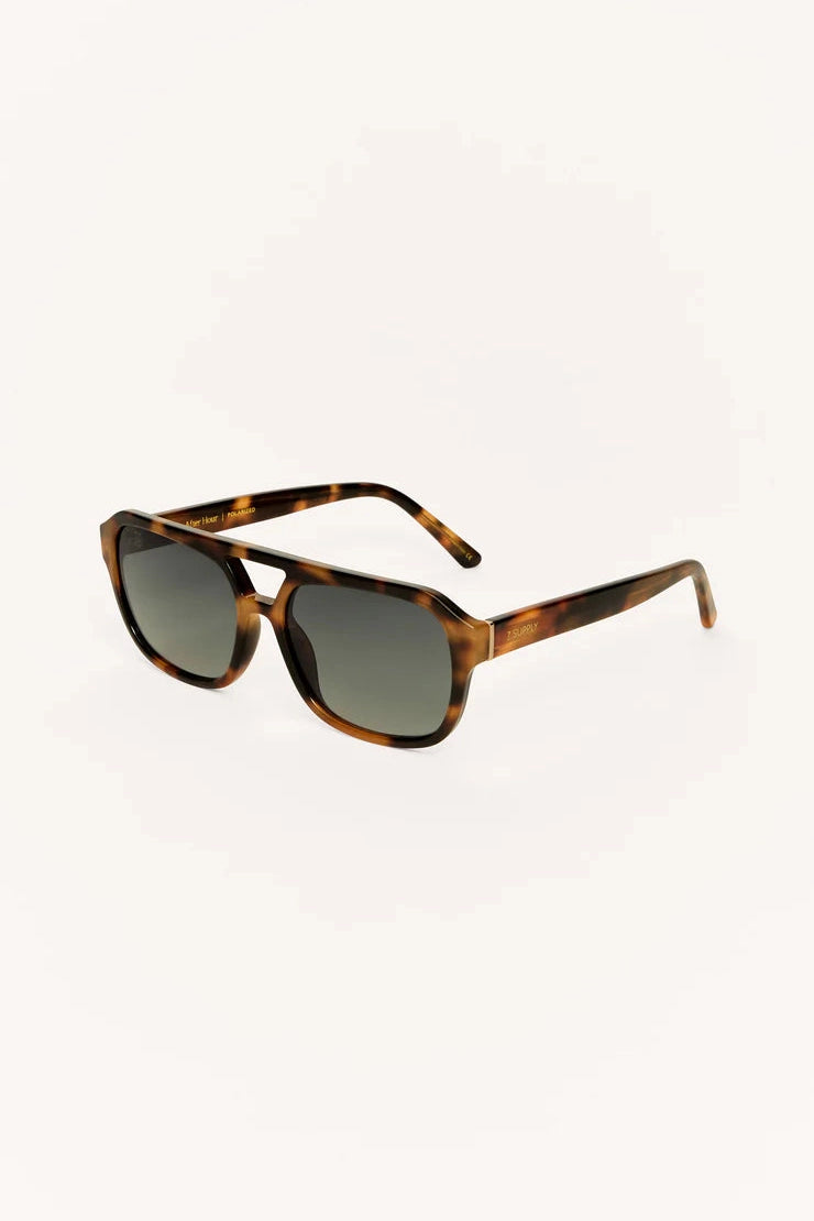 Dark tortoise polarized sunglasses angled side view, rectangular tinted lenses