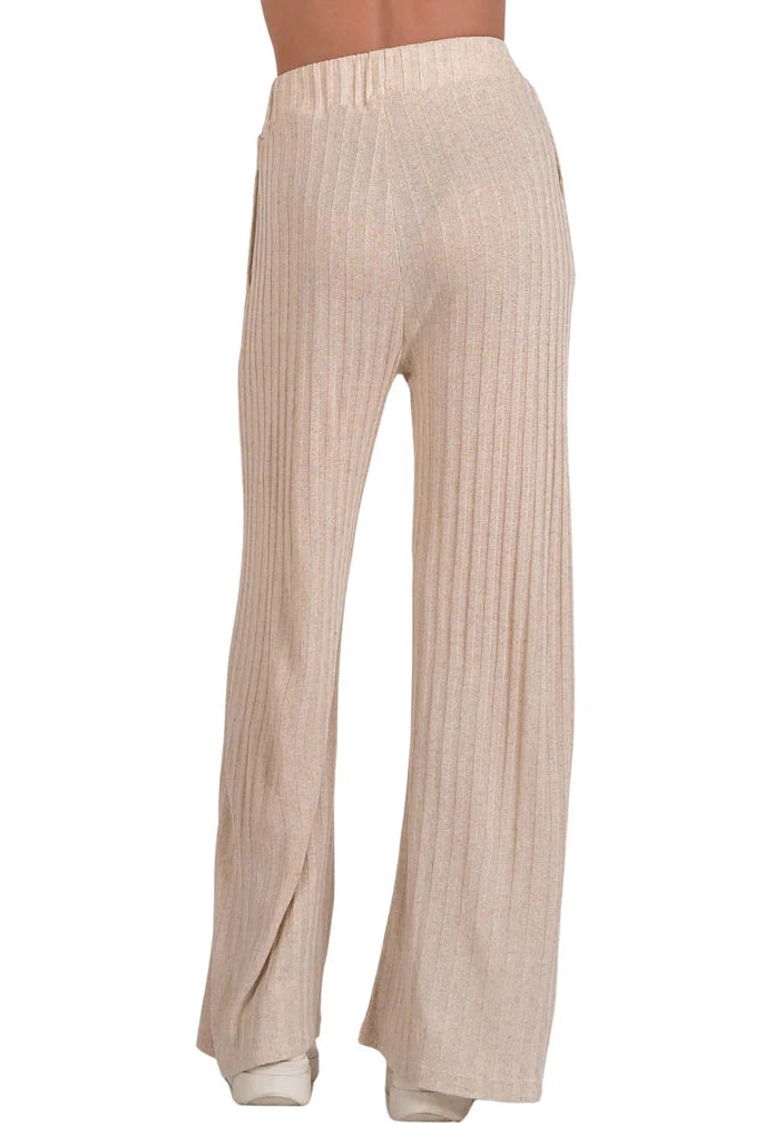 Natural ribbed pants with elastic waistband, wide flared legs and side slit detail