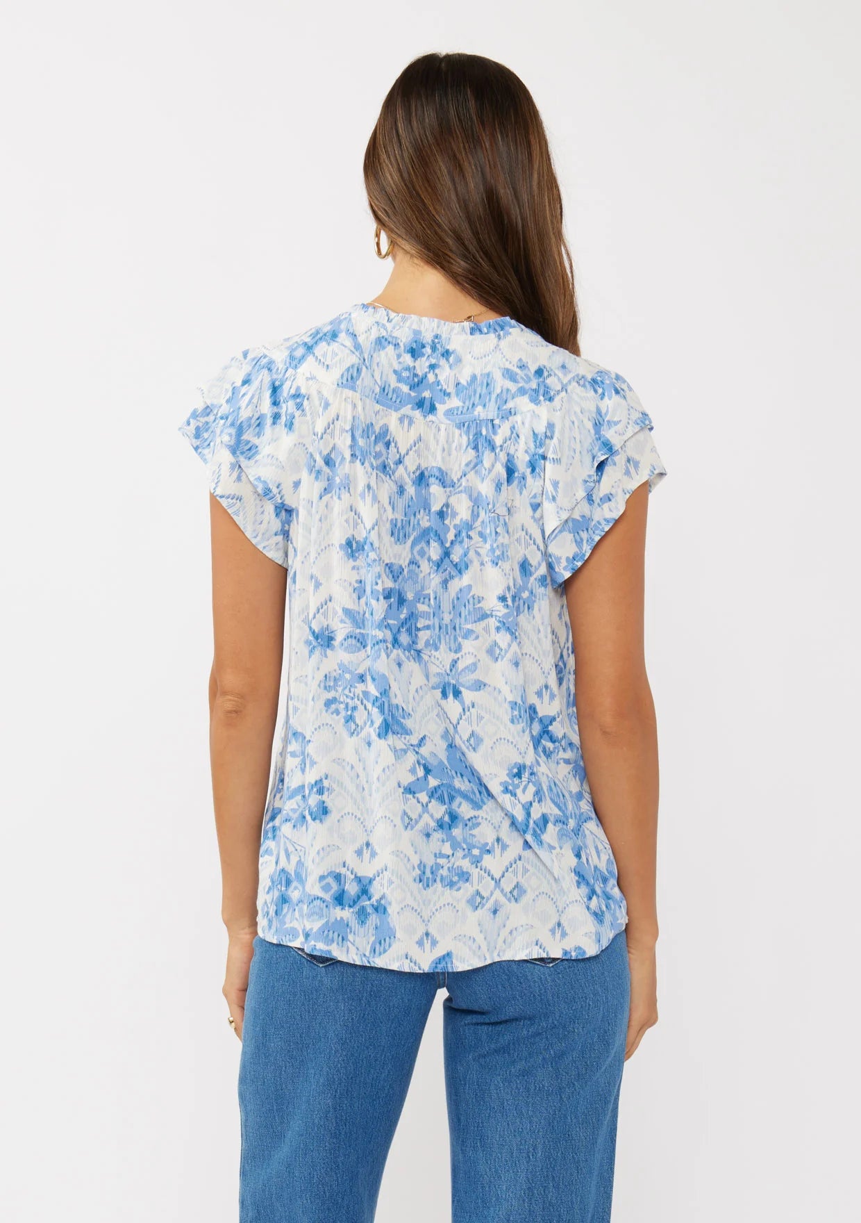 Double ruffle sleeve split neck top in off white and dusty blue back view