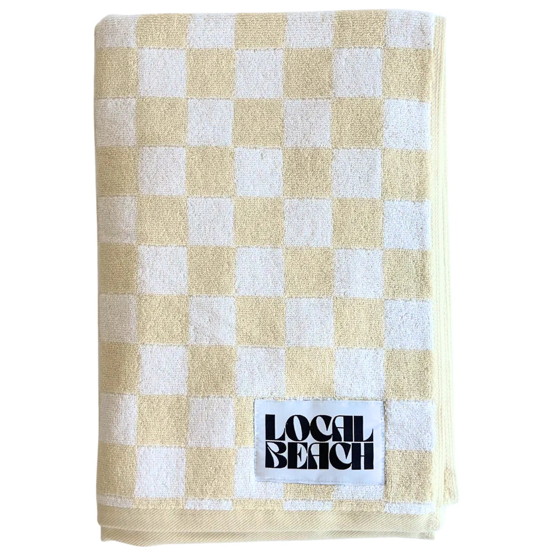 Checker beach and bath towel in cream and white front view
