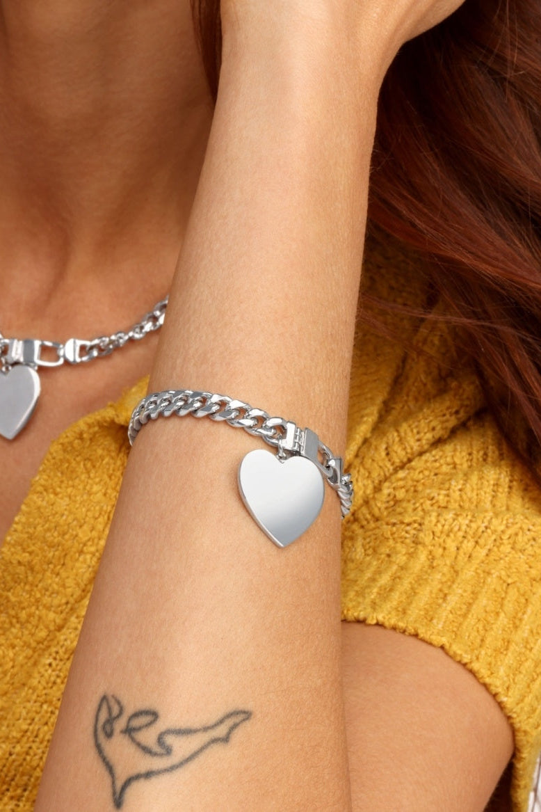 Silver Cuban bracelet with large heart charm and curb chain links