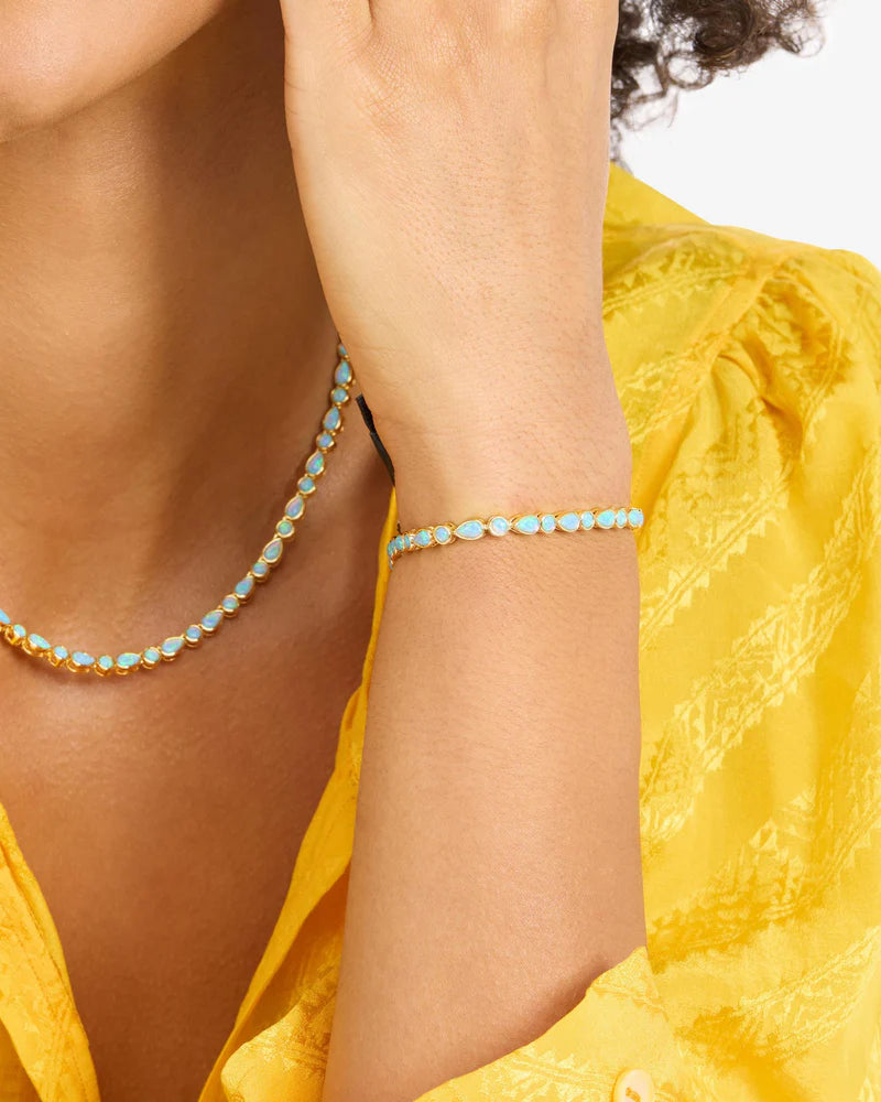 Isla tennis bracelet in gold with blue opal gems style view