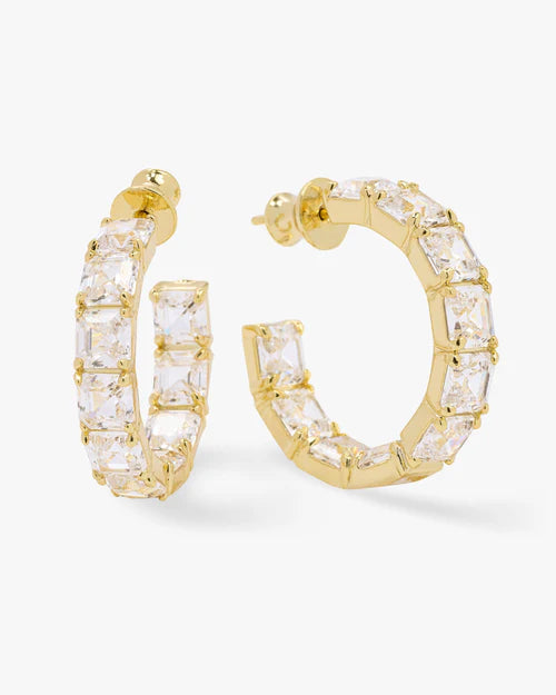 The queens 1" hoop earrings in gold with white diamonds