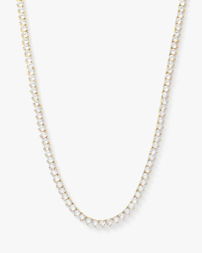 Not your basic tennis necklace 16" in gold with white diamonds