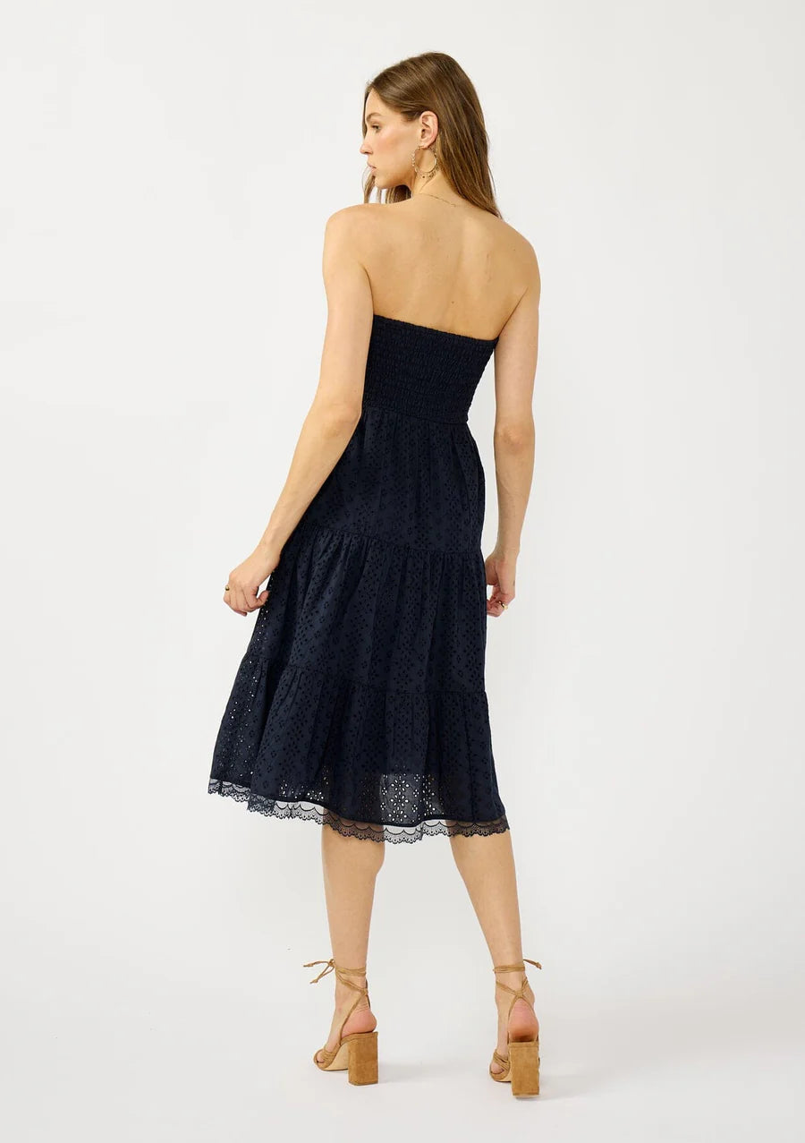 SMOCKED BUST TIERED EYELET DRESS IN NAVY BACK VIEW