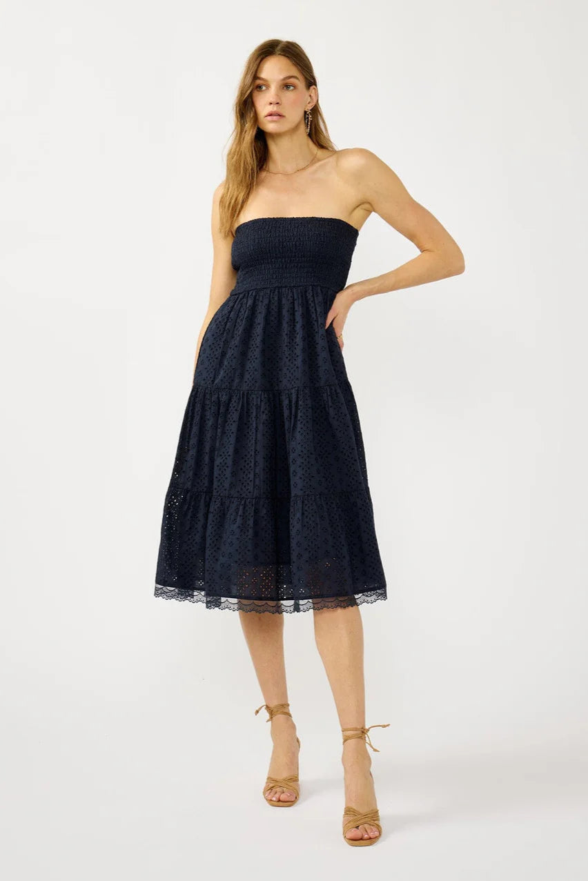 SMOCKED BUST TIERED EYELET DRESS IN NAVY FRONT VIEW