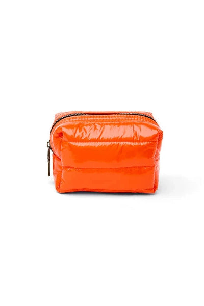 Orange cosmetic pouch with zip closure, compact rectangular bag