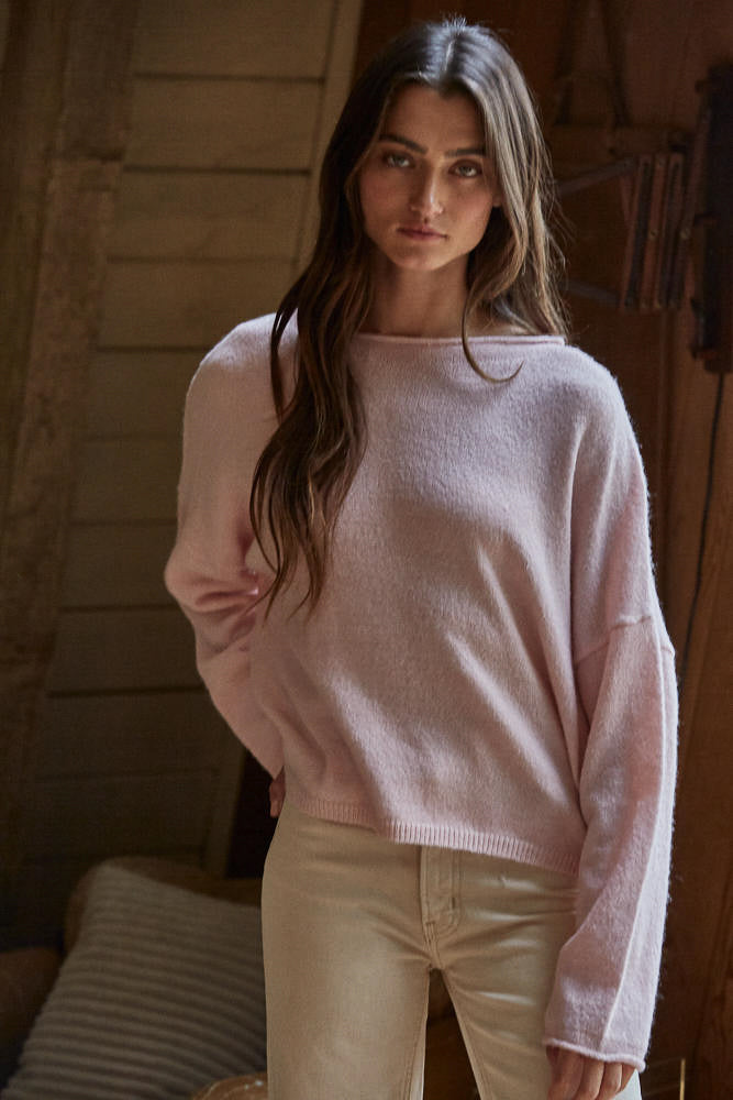 Light pink crewneck sweater with long sleeves