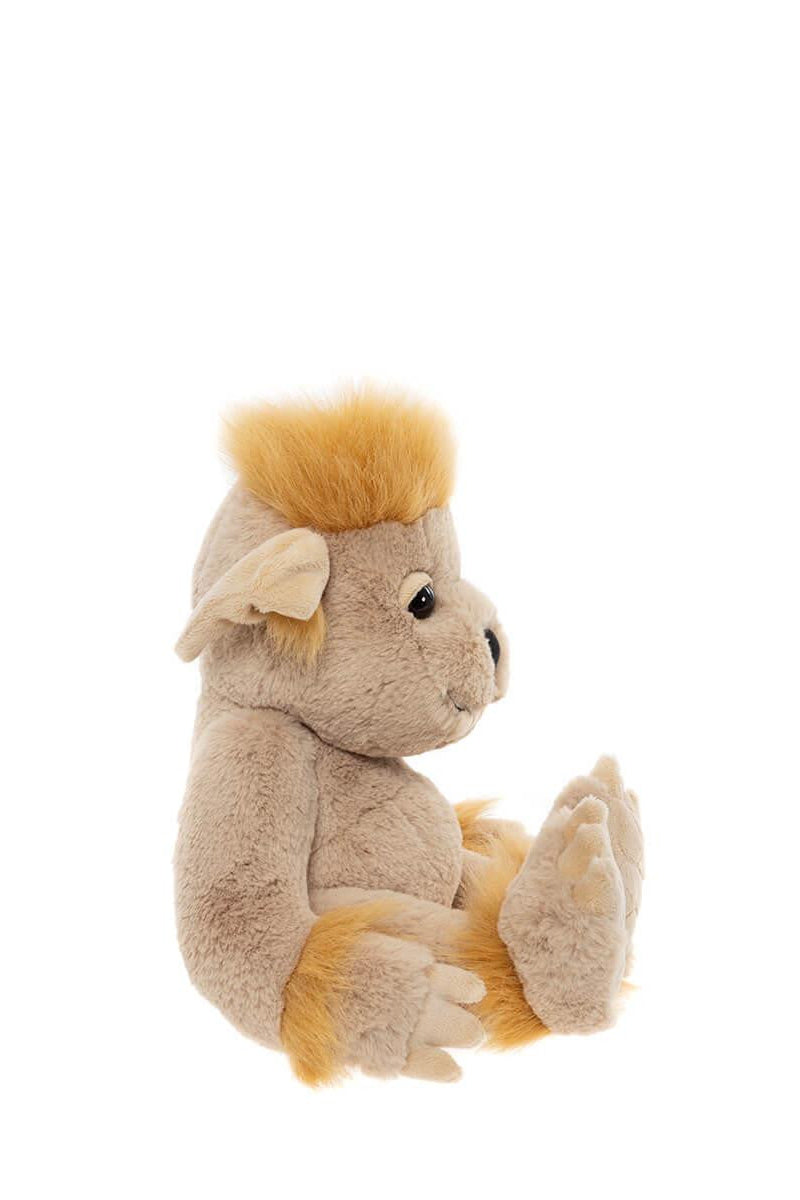 Side view of plush toy bedrock with a white background