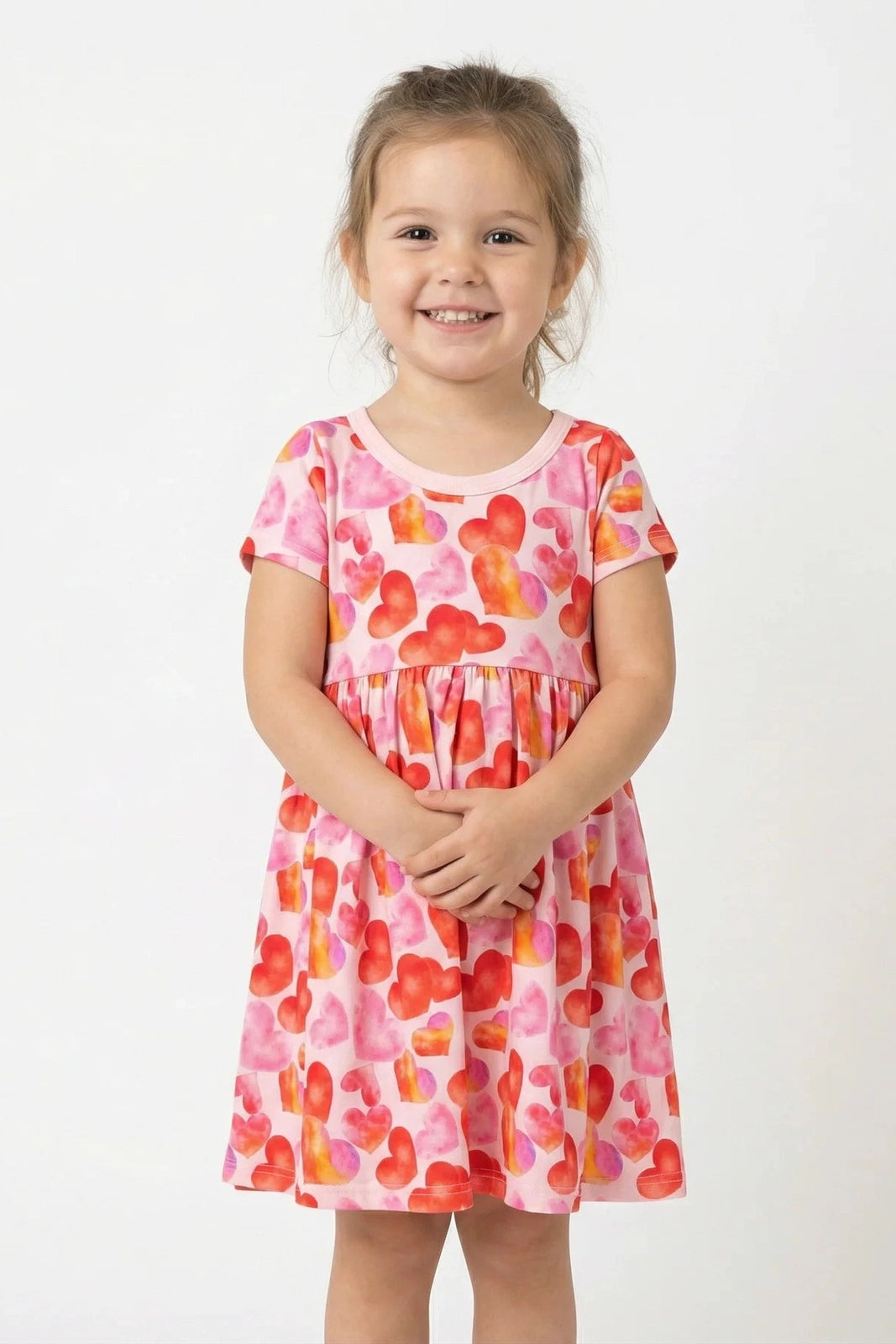 Pink heart print short sleeve dress with gathered skirt and round neckline