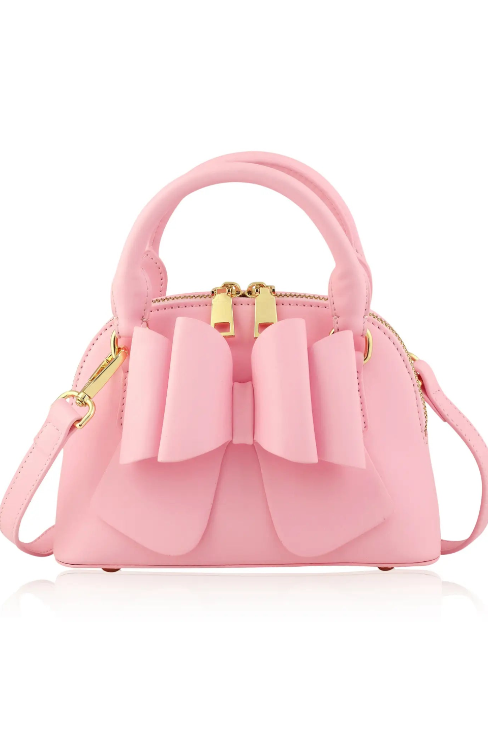 Light pink handbag with bow front, top handles, and adjustable shoulder strap