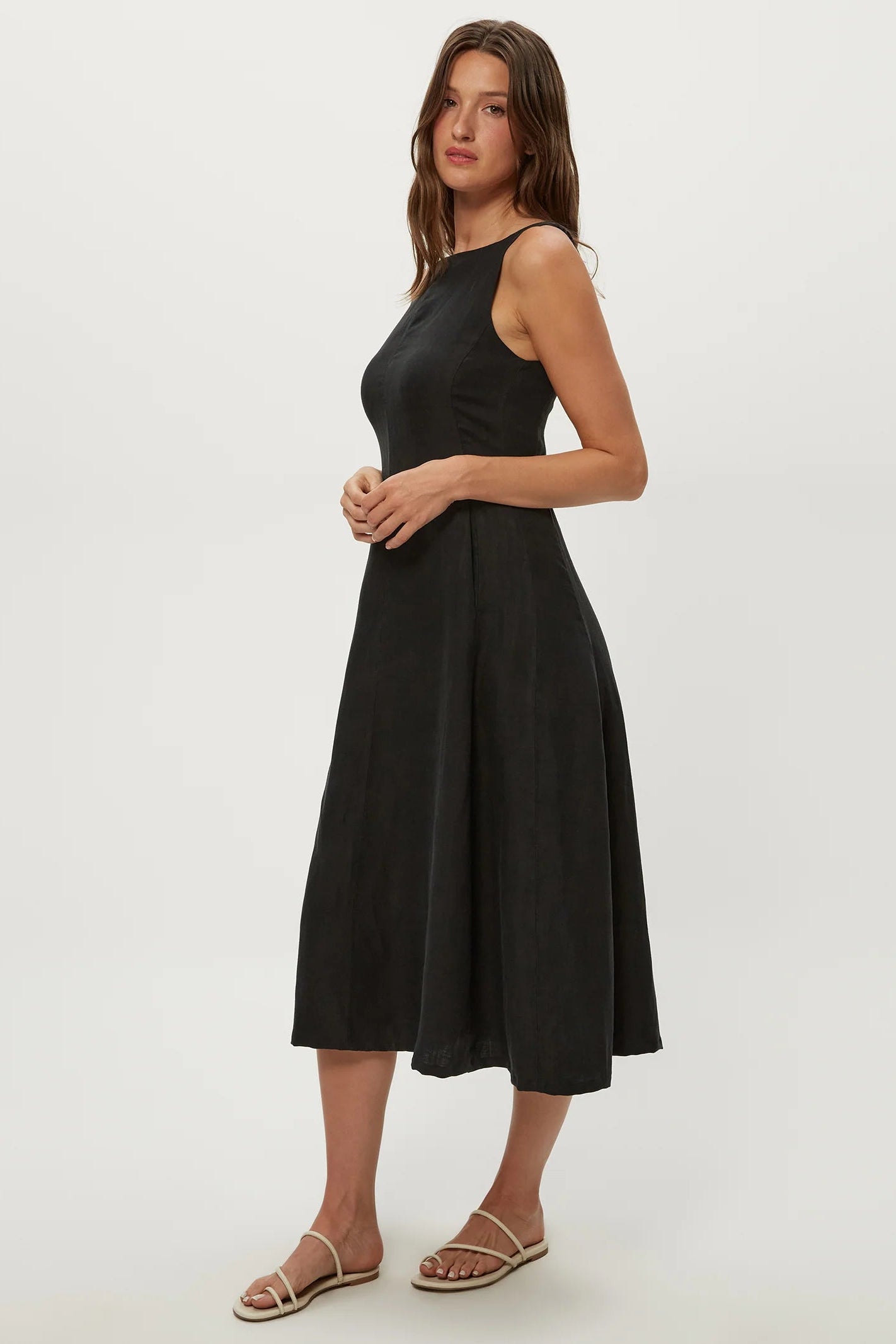 Black fit-and-flare midi dress with sleeveless bodice, square neckline, and wide skirt