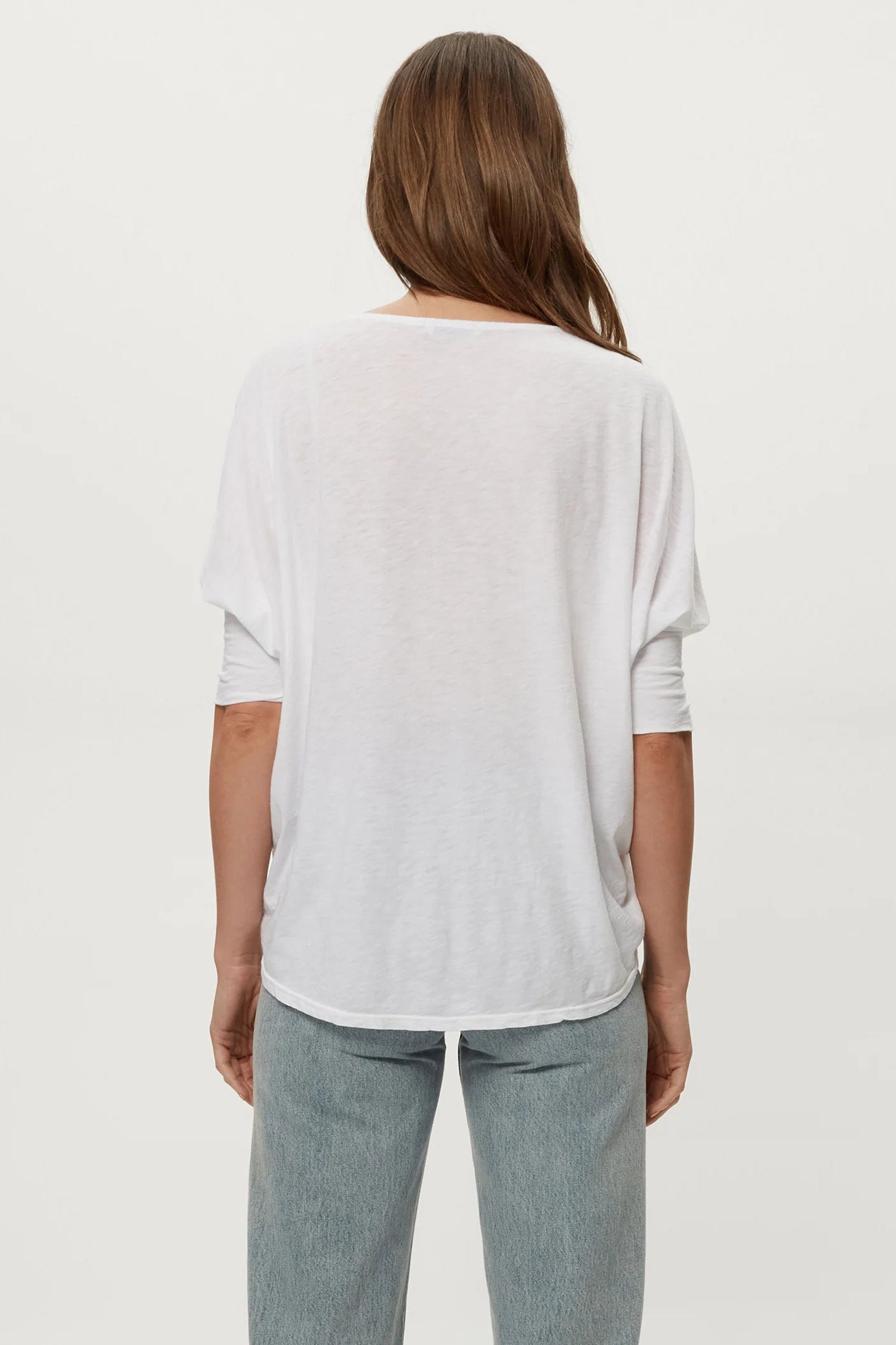 White dolman tee, back view, loose fit with short dolman sleeves