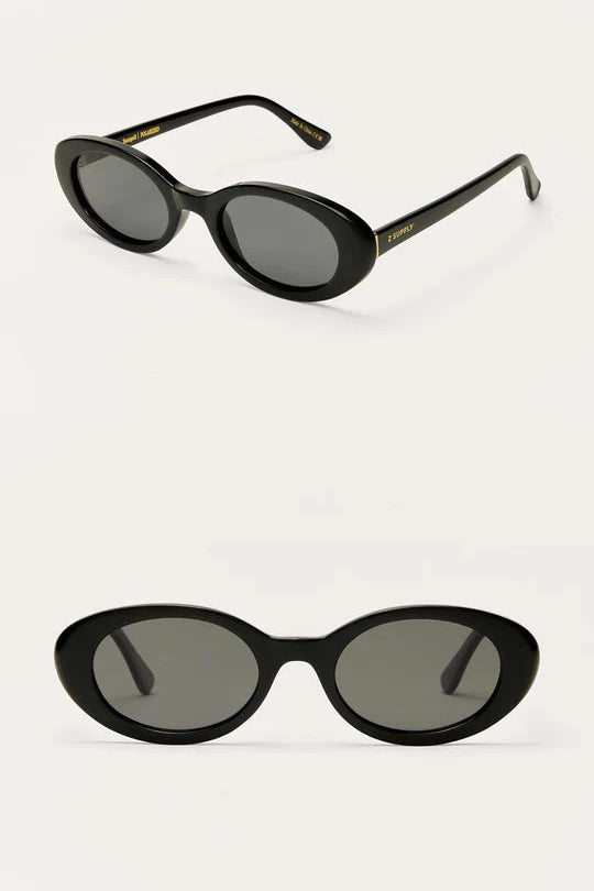 Black frame sunglasses with oval gray lenses and thin metal arms