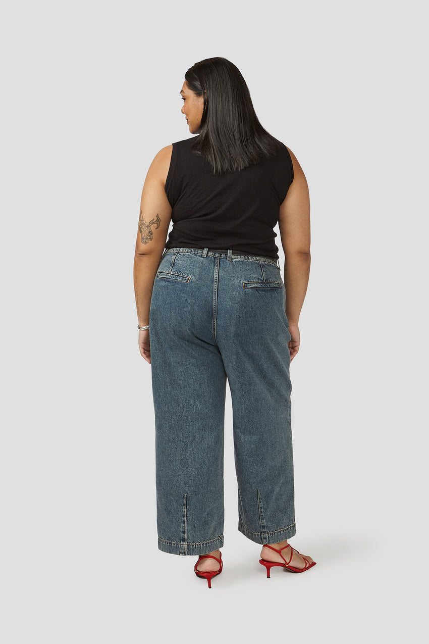 Denim trousers back view, relaxed wide-leg cut with straight hem and stitched seams