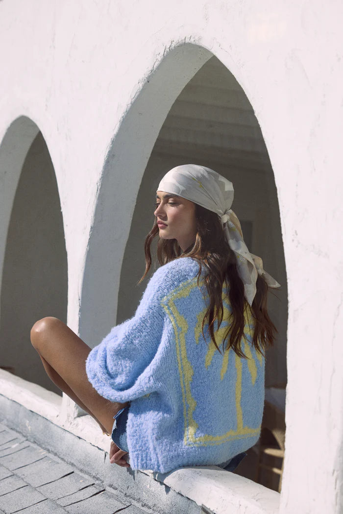 Light blue jacquard palm tree cardigan with yellow trim, long sleeves