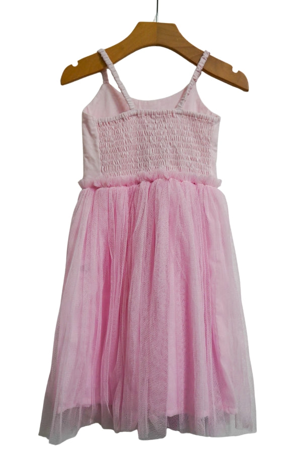 Pink rainbow tulle dress back view with spaghetti straps and smocked bodice