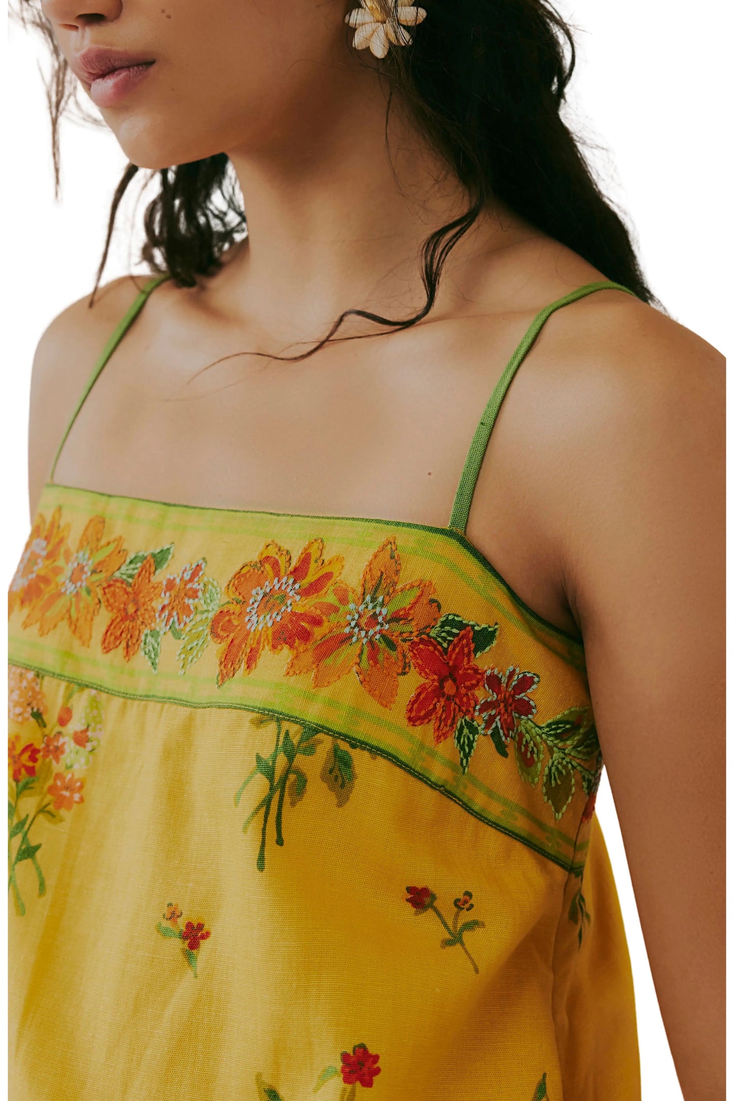 Yellow floral mini dress bodice detail with green trim and thin straps