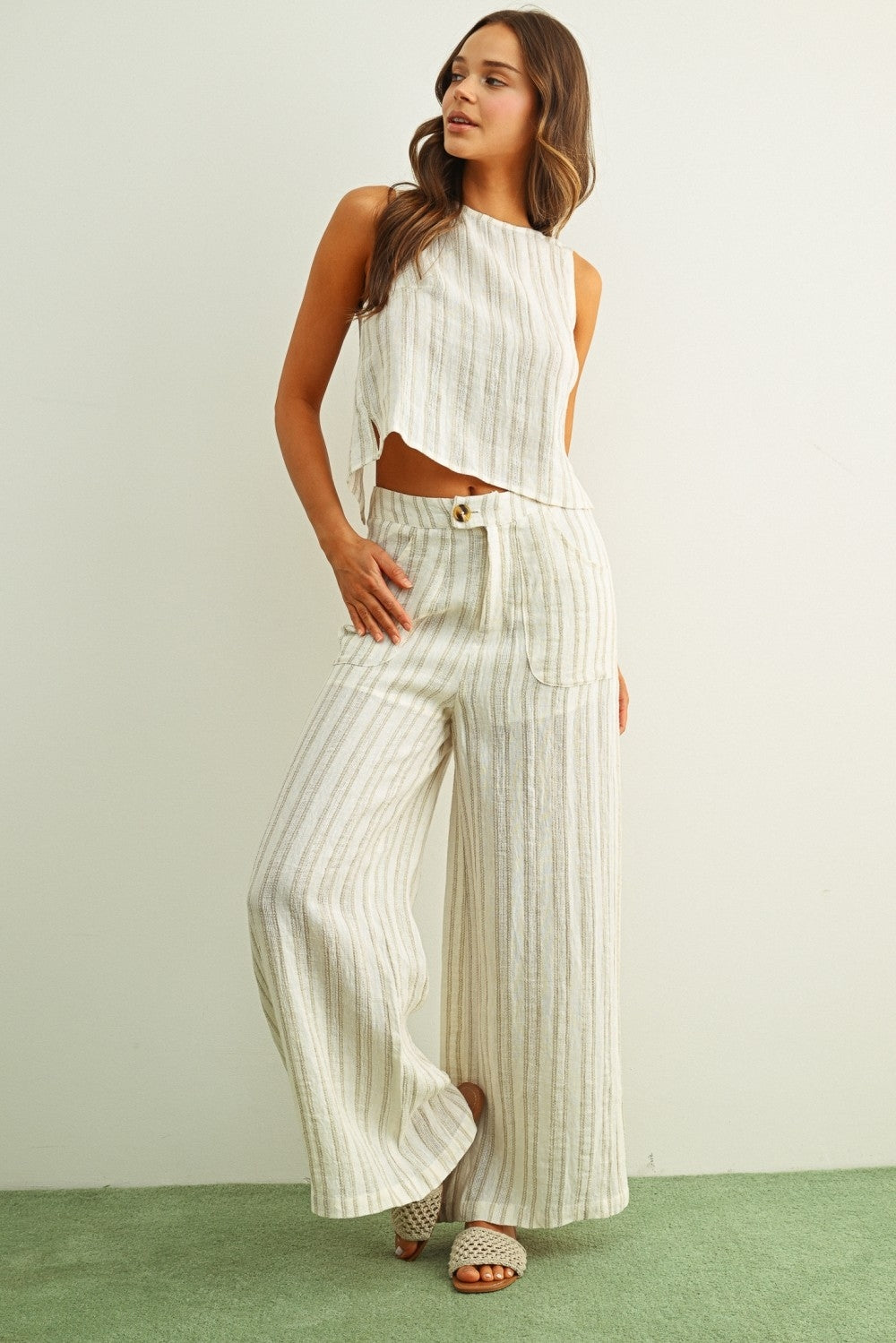 Vertical stripe linen pants with buttoned high waist and wide, flowing legs