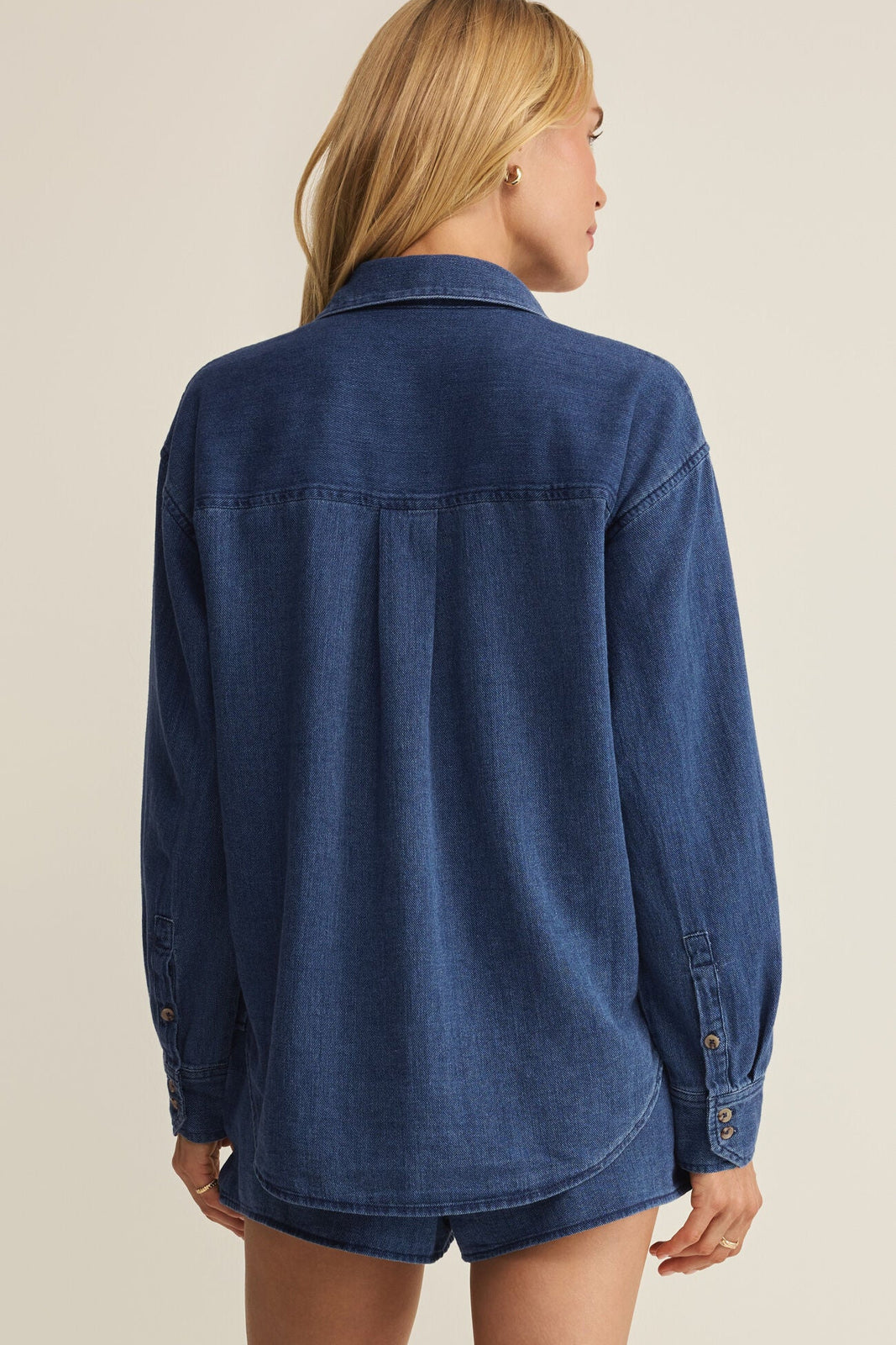 Dark blue twill button-up shirt back view with yoke seam and button placket