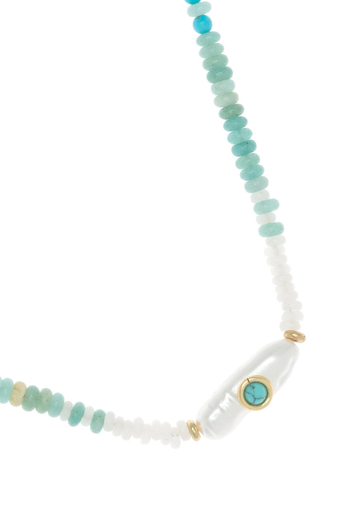 Short turquoise beaded necklace with oval gold charm, turquoise center and white beads