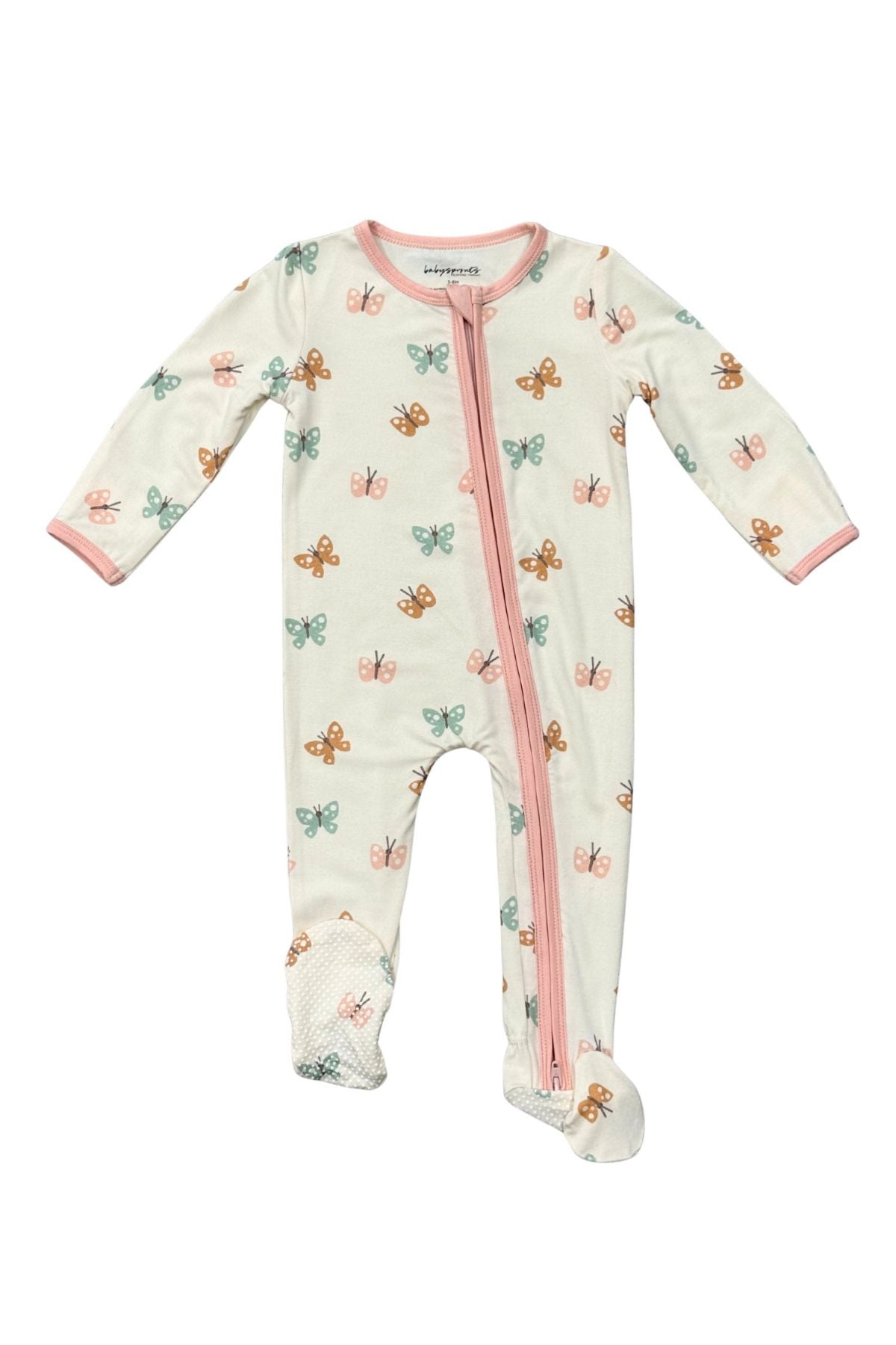 A baby footed sleeper with long sleeves, a front zipper, and an all-over pastel butterfly print on a cream background. The sleeper features pink trim along the collar, cuffs, and zipper, and is photographed flat against a white background.