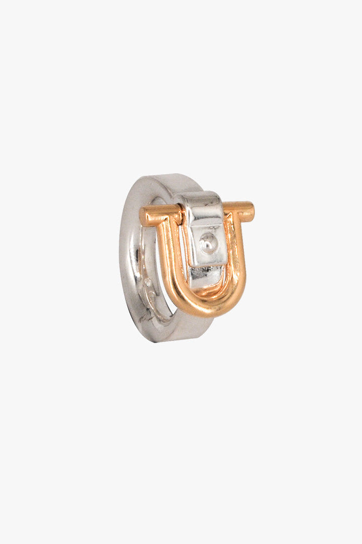 A two-tone Shackle ring featuring a silver-toned band and a rose gold U-shaped accent, shown on a plain light gray background.