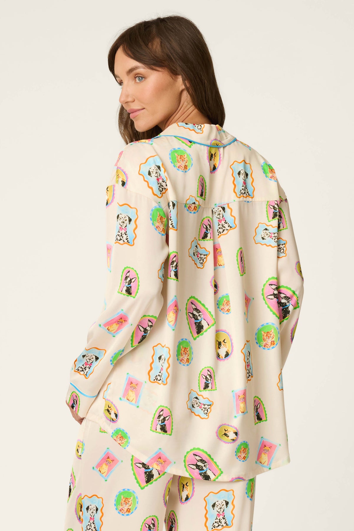 Woman shown from the back wearing picture purfect satin long sleeve pajama top and matching pajama pants