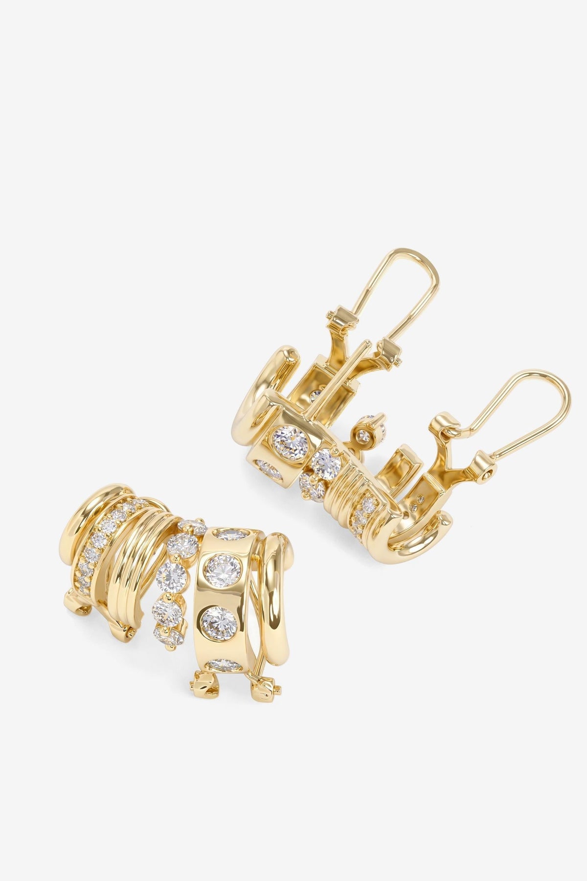 A pair of gold Ashley Venice Ear Crawler huggie hoop earrings decorated with multiple rows of small clear pavé gemstones, shown on a clean white background.