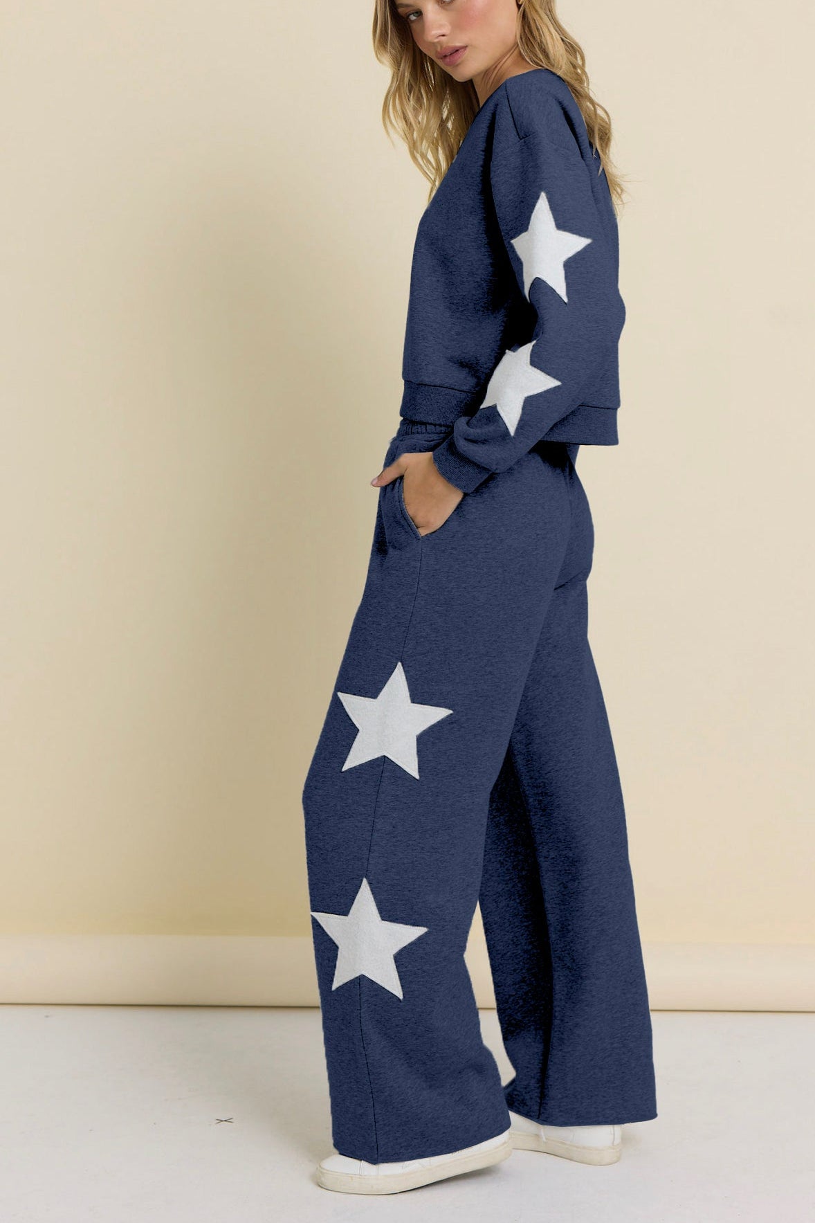 Navy terry wide-leg pants with large white star print on legs