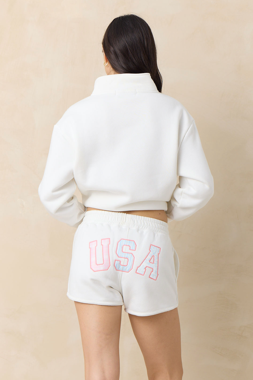 White fleece quarter-zip sweatshirt and matching shorts with USA logo