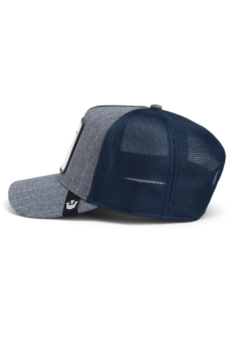 the suited champ trucker hat in navy side view