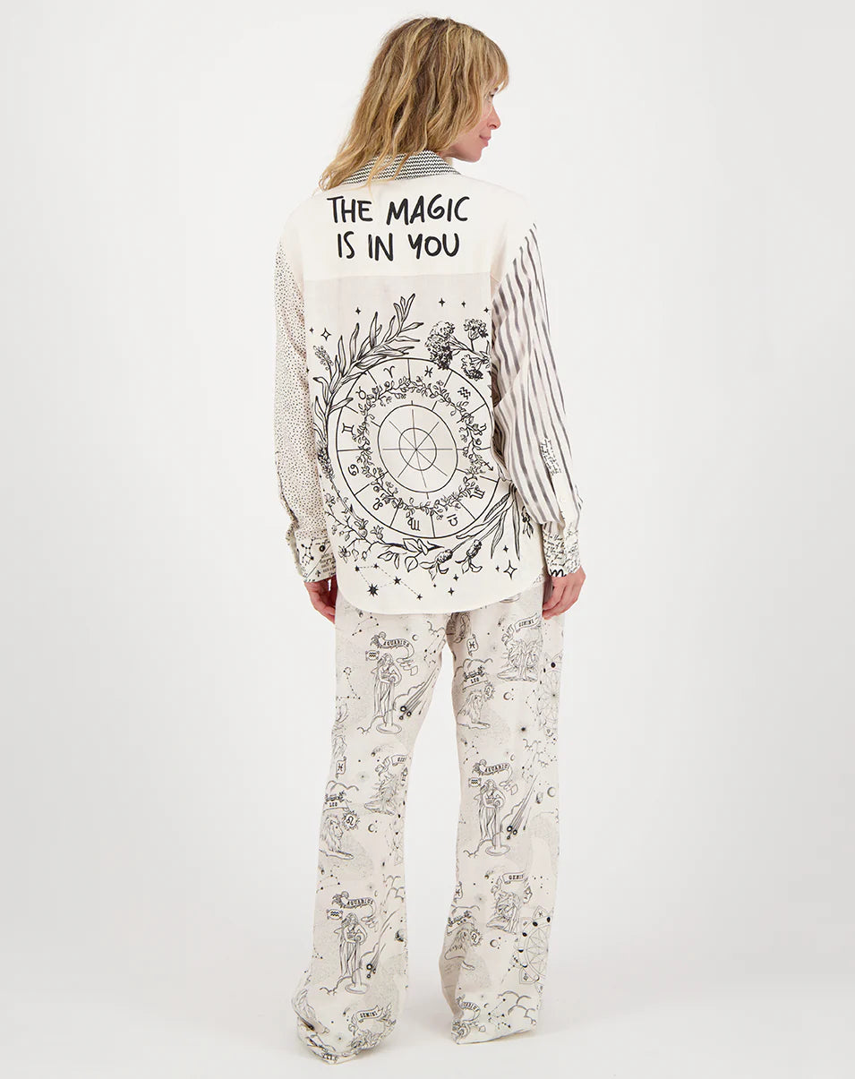 Zodiac shirt back with circular chart and “THE MAGIC IS IN YOU” text