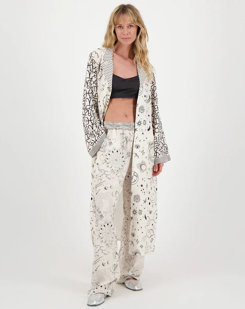 kimono with flared sleeves with zodiac print and dotted lapel and small striped border on model front view