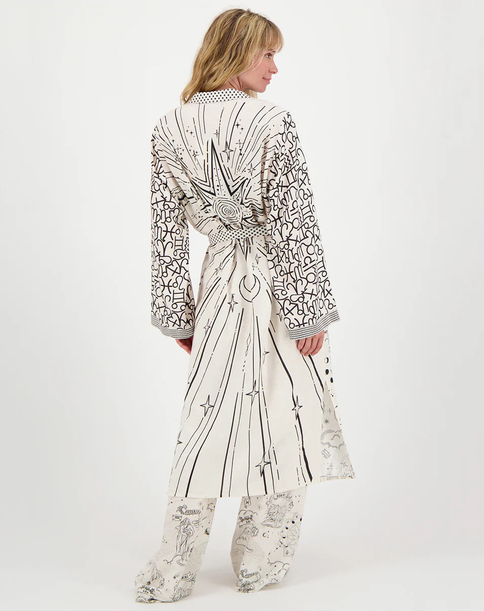 Printed kimono dress, back view, long sleeves and tied waist belt, light doodle pattern