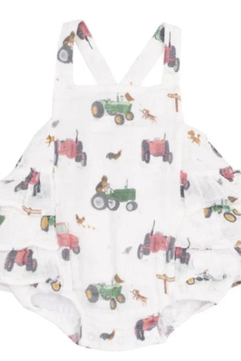 White tractor-print ruffle sunsuit with V-neck straps and tiered legs
