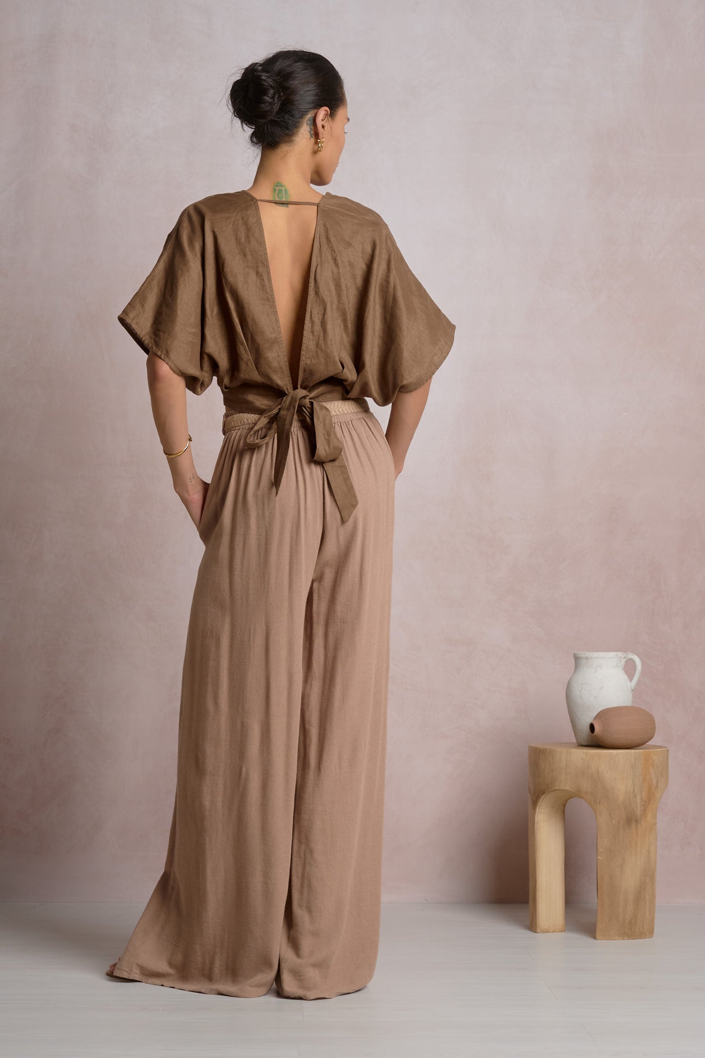 Brown crop top with open back and tie fastening at upper back