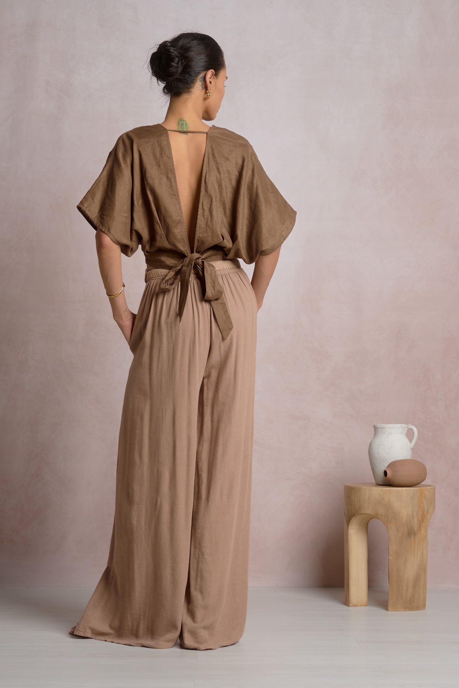 Brown crop top with open back and tie fastening at upper back