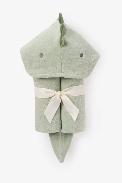 Green dinosaur-shaped hooded towel with a white ribbon on a white background