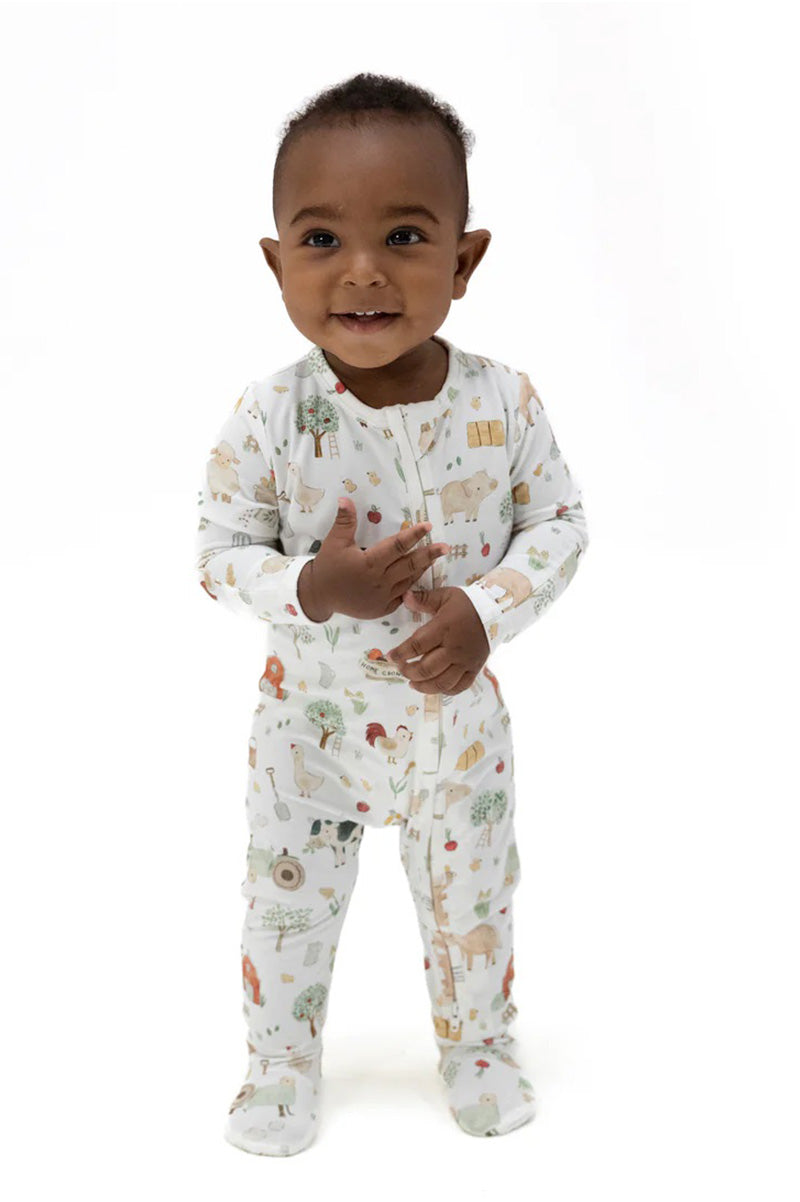 PRINTED ZIPPER FOOTIE, weiß mit bunten Tiermotiven und Knopfleiste vorne
