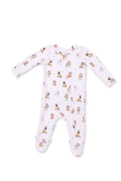 A baby long-sleeve footed sleeper in light pink with a repeating print of small brown and tan 'bestie dogs' , shown on a plain white background.