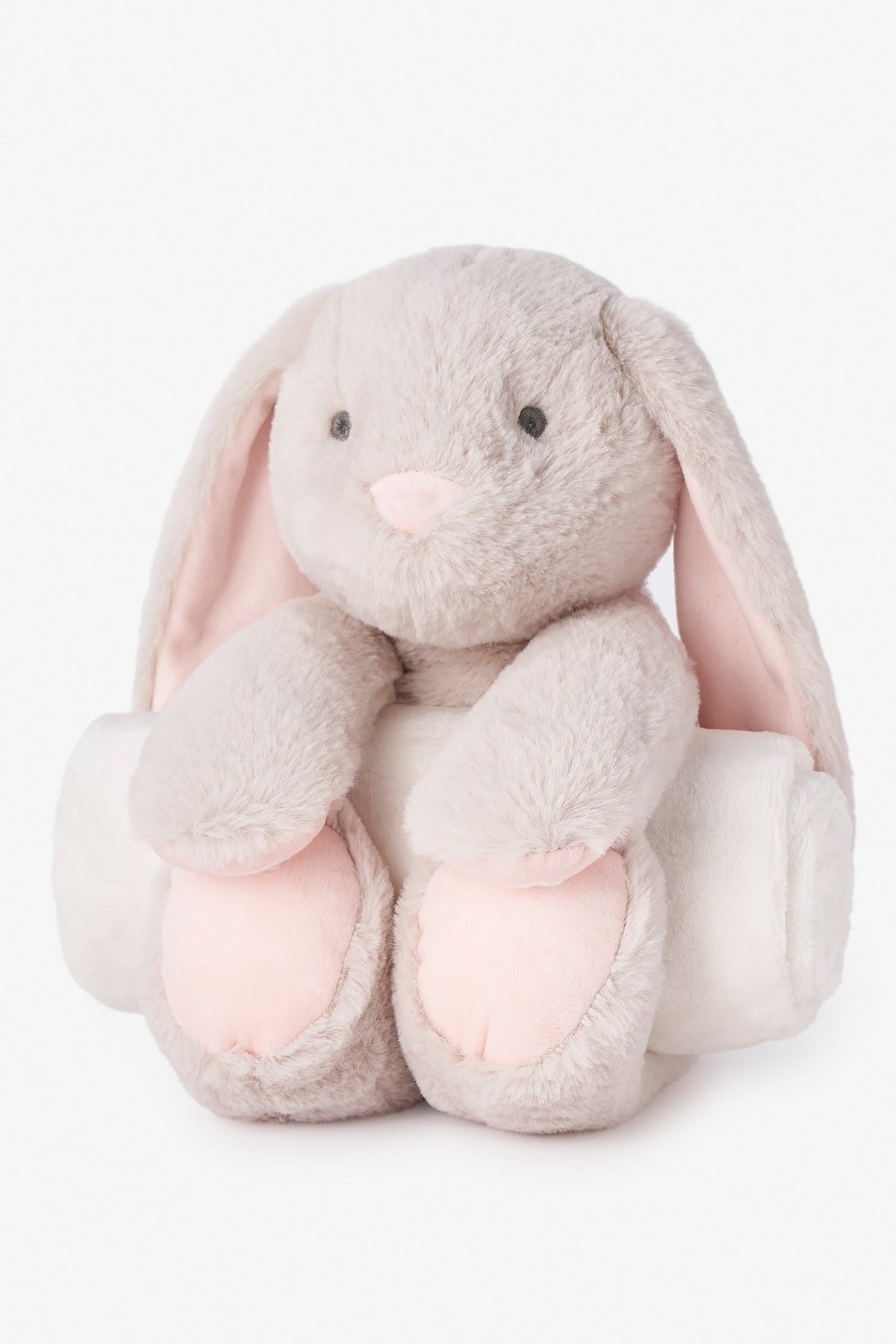 Bunny bedtime huggie plush on a white backgroune