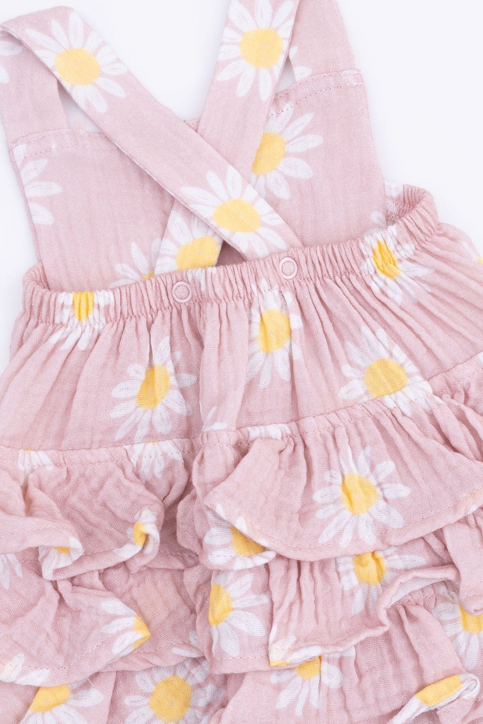 Pink daisy ruffle sunsuit close-up with elastic waist and layered ruffles