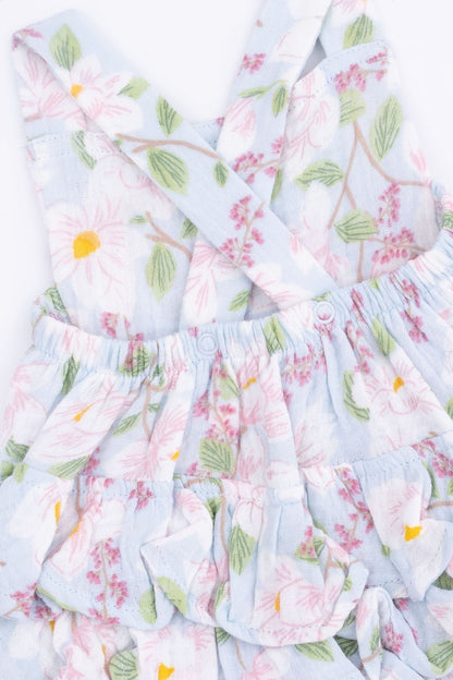 Floral ruffle sunsuit close-up with elastic waist and layered skirt tiers