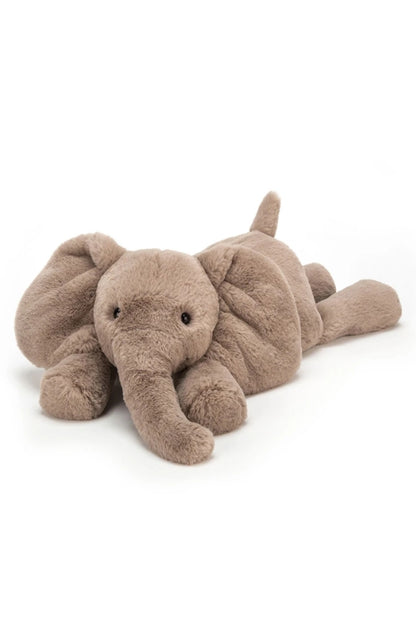 SMUDGE medium plush elephant in taupe, lying down with raised ears and trunk